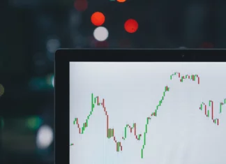 A laptop showing a chart with focus on Forex trading, how it works