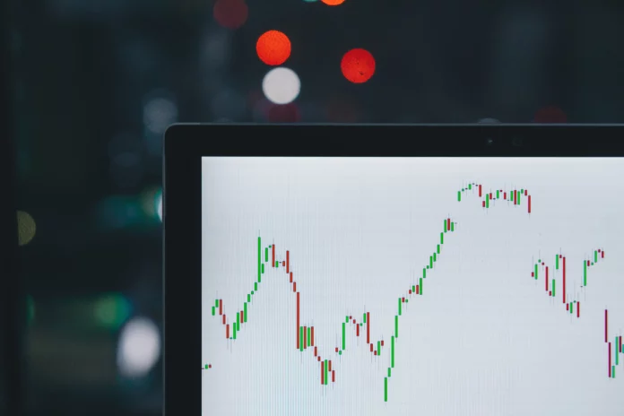 A laptop showing a chart with focus on Forex trading, how it works